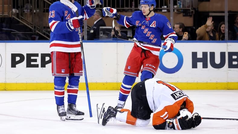 Mar 26, 2024; New York, New York, USA; New York Rangers left wing Alexis Lafreniere (13) celebrates his goal with left wing Artemi Panarin (10) in front of Philadelphia Flyers right wing Travis Konecny (11) during the third period at Madison Square Garden. Mandatory Credit: Brad Penner-USA TODAY Sports