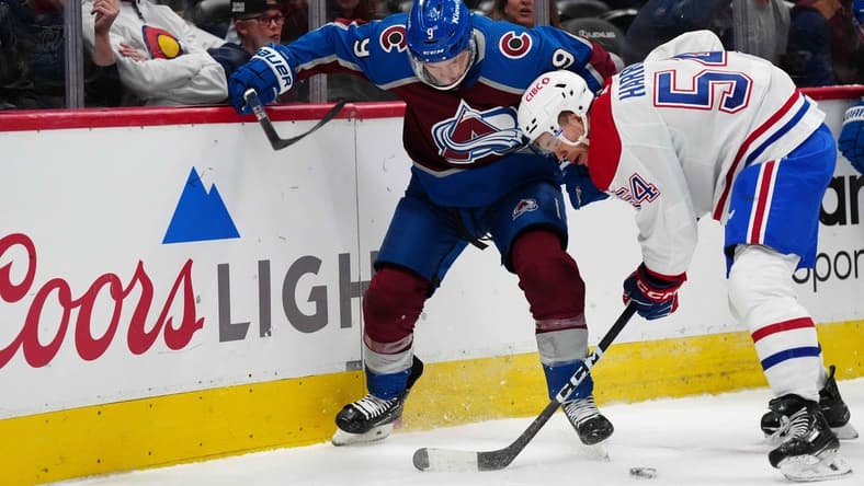 Mar 26, 2024; Denver, Colorado, USA; Montreal Canadiens defenseman Jordan Harris (54) and Colorado Avalanche left wing Zach Parise (9) battle for the puck in the first period at Ball Arena. Mandatory Credit: Ron Chenoy-USA TODAY Sports