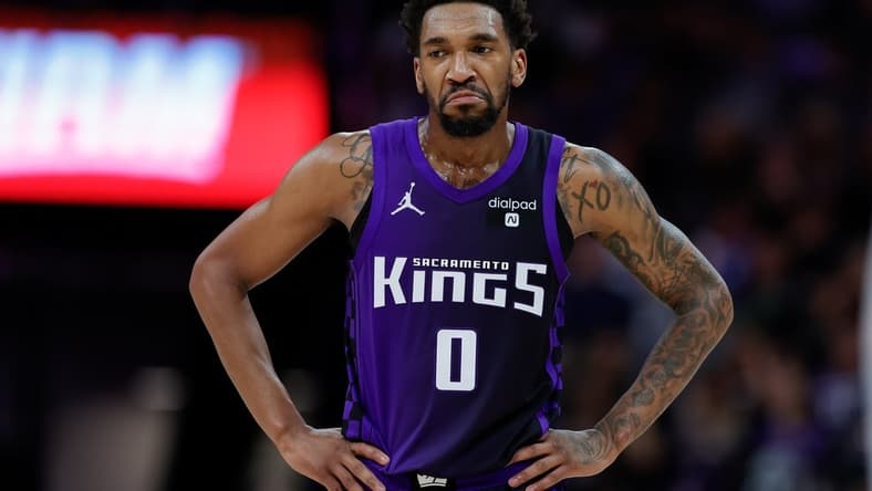 Mar 26, 2024; Sacramento, California, USA; Sacramento Kings guard Malik Monk (0) looks on during the fourth quarter against the Dallas Mavericks at Golden 1 Center. Mandatory Credit: Sergio Estrada-USA TODAY Sports