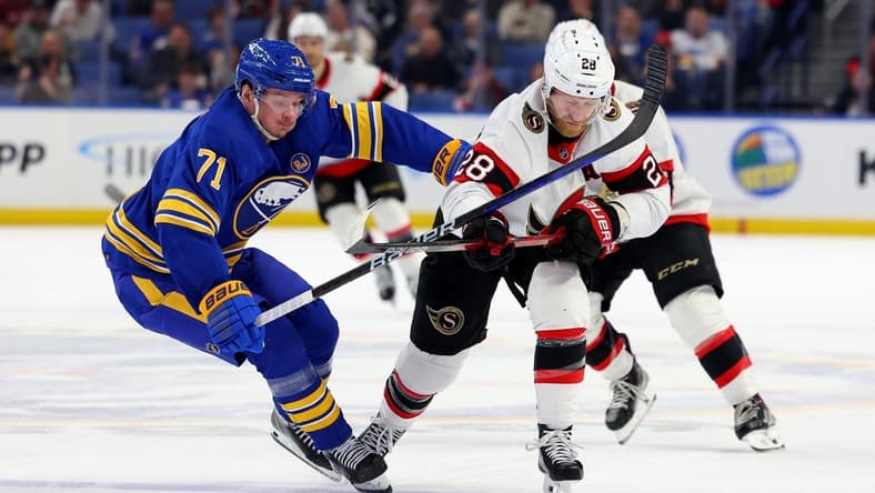 Mar 27, 2024; Buffalo, New York, USA;  Buffalo Sabres left wing Victor Olofsson (71) and Ottawa Senators right wing Claude Giroux (28) battle for a loose puck during the second period at KeyBank Center. Mandatory Credit: Timothy T. Ludwig-USA TODAY Sports