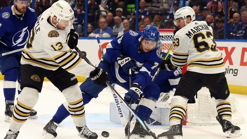 Mar 27, 2024; Tampa, Florida, USA; Tampa Bay Lightning defenseman Emil Martinsen Lilleberg (78) defends Boston Bruins center Charlie Coyle (13) and left wing Brad Marchand (63) during the second period at Amalie Arena. Mandatory Credit: Kim Klement Neitzel-USA TODAY Sports