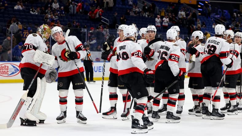 Mar 27, 2024; Buffalo, New York, USA; The Ottawa Senators celebrate a win over the Buffalo Sabres at KeyBank Center. Mandatory Credit: Timothy T. Ludwig-USA TODAY Sports