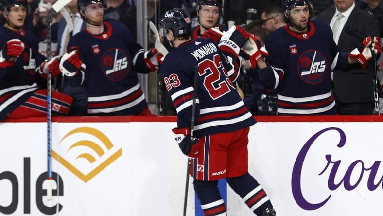 Mar 28, 2024; Winnipeg, Manitoba, CAN; Winnipeg Jets center Sean Monahan (23) celebrates his second period goal against the Vegas Golden Knights at Canada Life Centre. Mandatory Credit: James Carey Lauder-USA TODAY Sports