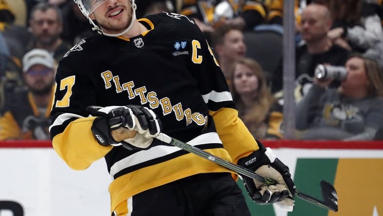 Mar 28, 2024; Pittsburgh, Pennsylvania, USA; Pittsburgh Penguins center Sidney Crosby (87) reacts on the ice against the Columbus Blue Jackets during the third period at PPG Paints Arena. The Penguins won 3-2. Mandatory Credit: Charles LeClaire-USA TODAY Sports