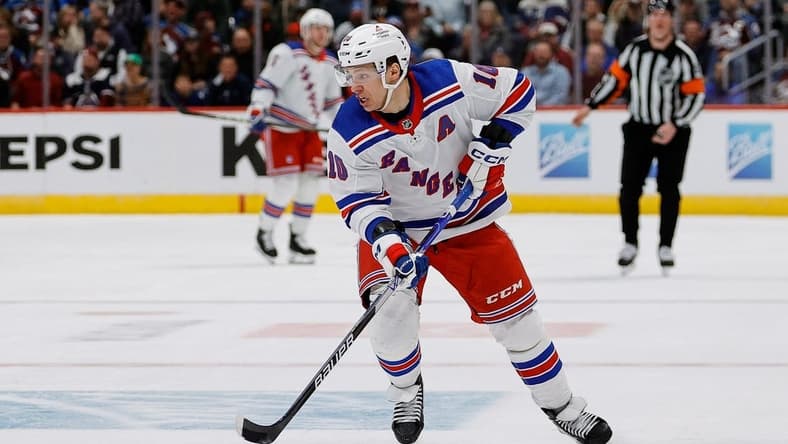 Mar 28, 2024; Denver, Colorado, USA; New York Rangers left wing Artemi Panarin (10) controls the puck in the third period against the Colorado Avalanche at Ball Arena. Mandatory Credit: Isaiah J. Downing-USA TODAY Sports