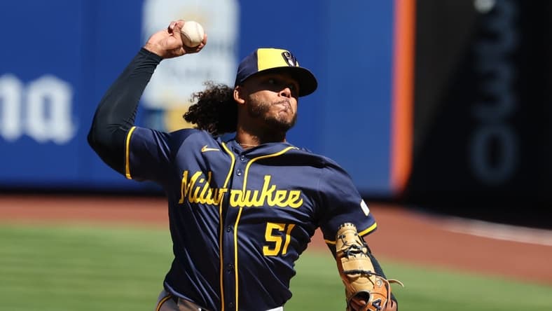 Mar 29, 2024; New York City, New York, USA; Milwaukee Brewers starting pitcher Freddy Peralta (51) delivers a pitch during the first inning against the New York Mets at Citi Field. Mandatory Credit: Vincent Carchietta-USA TODAY Sports