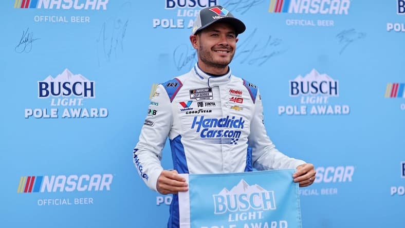 Mar 30, 2024; Richmond, Virginia, USA; NASCAR Cup Series driver Kyle Larson (5) celebrates within the pole after qualifying for the Toyota Owners 400 at Richmond Raceway. Mandatory Credit: Peter Casey-USA TODAY Sports