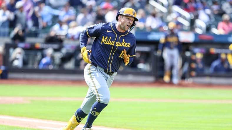 Mar 30, 2024; New York City, New York, USA; Milwaukee Brewers designated hitter Rhys Hoskins (12) reacts after hitting a two-run home run in the third inning New York Mets at Citi Field. Mandatory Credit: Wendell Cruz-USA TODAY Sports