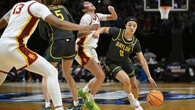 Mar 30, 2024; Portland, OR, USA; Baylor Lady Bears guard Jada Walker (11) drives to the basket during the first half against USC Trojans guard Kayla Padilla (45) in the semifinals of the Portland Regional of the 2024 NCAA Tournament at the Moda Center. Mandatory Credit: Troy Wayrynen-USA TODAY Sports