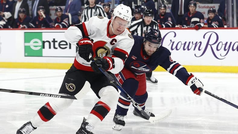 Mar 30, 2024; Winnipeg, Manitoba, CAN; Ottawa Senators left wing Brady Tkachuk (7) is chased down by Winnipeg Jets defenseman Neal Pionk (4) in the first period at Canada Life Centre. Mandatory Credit: James Carey Lauder-USA TODAY Sports