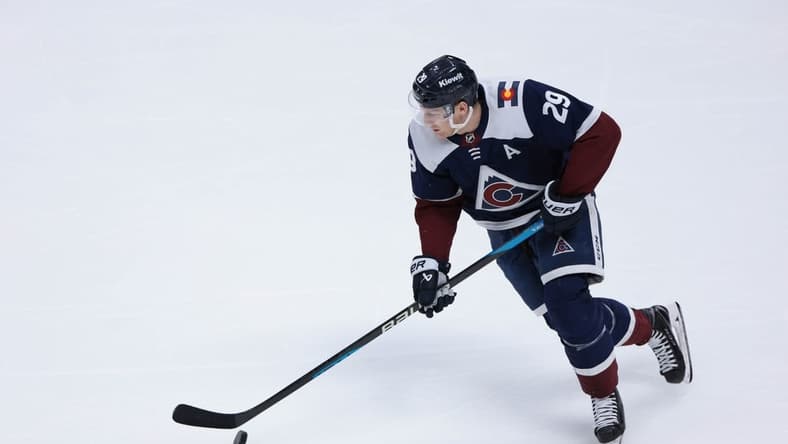 Mar 30, 2024; Denver, Colorado, USA; Colorado Avalanche center Nathan MacKinnon (29) skates with the puck during the third period against the Nashville Predators at Ball Arena. Mandatory Credit: Andrew Wevers-USA TODAY Sports