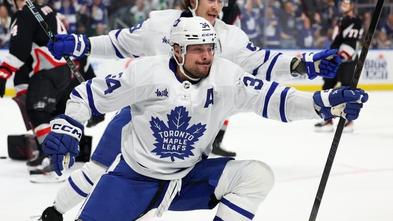 Mar 30, 2024; Buffalo, New York, USA; Toronto Maple Leafs center Auston Matthews (34) reacts after scoring his 60th goal of the year during the third period against the Buffalo Sabres at KeyBank Center. Mandatory Credit: Timothy T. Ludwig-USA TODAY Sports