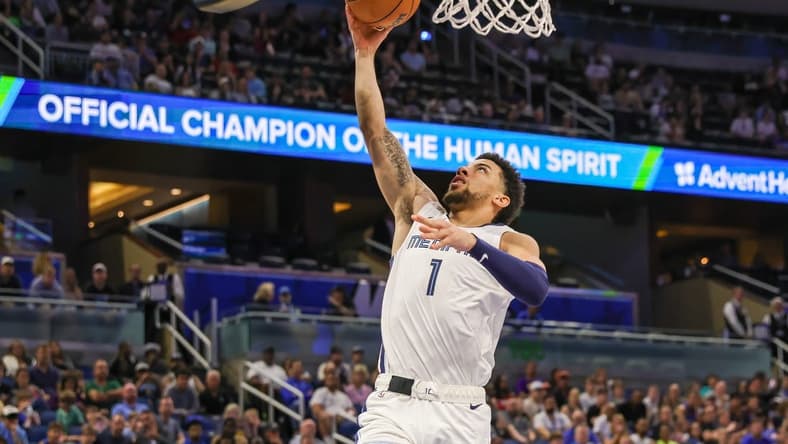 Mar 30, 2024; Orlando, Florida, USA; Memphis Grizzlies guard Scotty Pippen Jr. (1) goes to the basket during the second half against the Orlando Magic at KIA Center. Mandatory Credit: Mike Watters-USA TODAY Sports