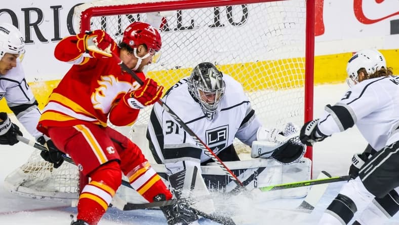 Mar 30, 2024; Calgary, Alberta, CAN; Los Angeles Kings goaltender David Rittich (31) makes a save against the Calgary Flames during the first period at Scotiabank Saddledome. Mandatory Credit: Sergei Belski-USA TODAY Sports