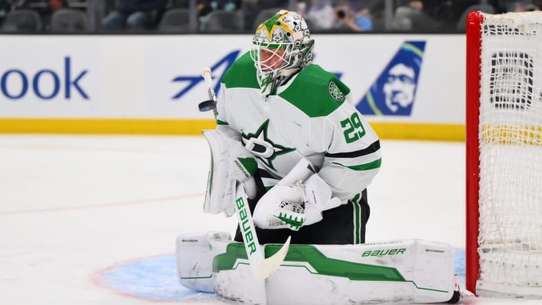 Mar 30, 2024; Seattle, Washington, USA; Dallas Stars goaltender Jake Oettinger (29) blocks a goal shot against the Seattle Kraken during the second period at Climate Pledge Arena. Mandatory Credit: Steven Bisig-USA TODAY Sports