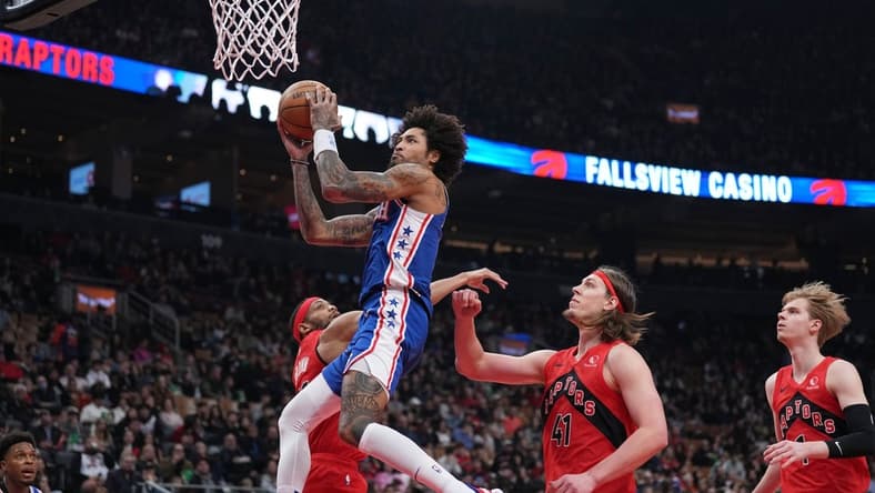 Mar 31, 2024; Toronto, Ontario, CAN; Philadelphia 76ers guard Kelly Oubre Jr. (9) drives to the basket over Toronto Raptors forward Kelly Olynyk (41) during the first quarter at Scotiabank Arena. Mandatory Credit: Nick Turchiaro-USA TODAY Sports