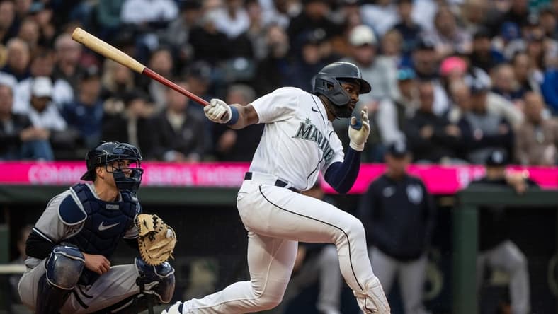 May 31, 2023; Seattle, Washington, USA; Seattle Mariners designated hitter Taylor Trammell (5) takes a swing during an at-bat against the New York Yankees at T-Mobile Park. Mandatory Credit: Stephen Brashear-USA TODAY Sports