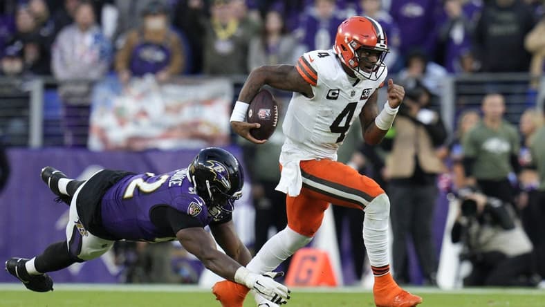 Nov 12, 2023; Baltimore, Maryland, USA; Cleveland Browns quarterback Deshaun Watson (4) runs with the ball as Baltimore Ravens defensive tackle Justin Madubuike (92) defends during the second half at M&T Bank Stadium. Mandatory Credit: Jessica Rapfogel-USA TODAY Sports