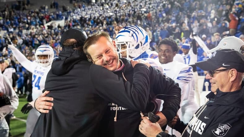 Memphis' head coach Ryan Silverfield celebrates with his team after they defeated Iowa State 36-26 in the AutoZone Liberty Bowl at Simmons Bank Liberty Stadium on Dec. 29, 2023.
