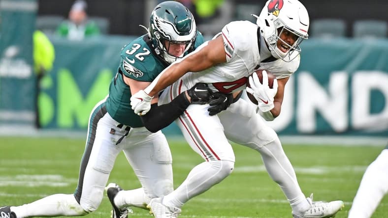 Dec 31, 2023; Philadelphia, Pennsylvania, USA; Arizona Cardinals wide receiver Rondale Moore (4) is tackled by Philadelphia Eagles safety Reed Blankenship (32) during the fourth quarter at Lincoln Financial Field. Mandatory Credit: Eric Hartline-USA TODAY Sports