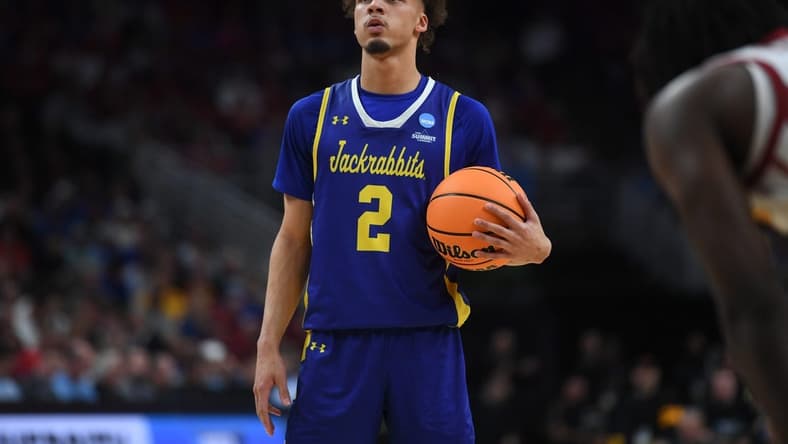 South Dakota State's guard Zeke Mayo (2) takes a deep breath before shooting the free throw during the second half on Thursday, March 21, 2024 at the CHI Health Center in Omaha, Nebraska.