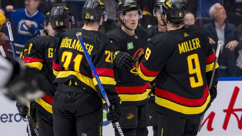 Mar 25, 2024; Vancouver, British Columbia, CAN; Vancouver Canucks defenseman Quinn Hughes (43), forward Nils Hoglander (21), forward Brock Boeser (6), forward J.T. Miller (9) and forward Elias Pettersson (40) celebrate Boeser’s goal against the Los Angeles Kings in the third period at Rogers Arena. Kings won 3 -2. Mandatory Credit: Bob Frid-USA TODAY Sports