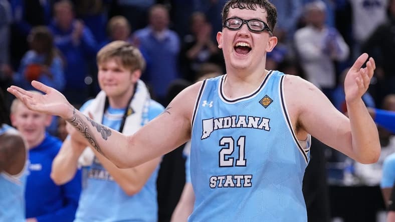 Indiana State Sycamores center Robbie Avila (21) yells in excitement Tuesday, March 26, 2024, after defeated the Cincinnati Bearcats in the quarterfinals of the NIT at the Hulman Center in Terre Haute. The Indiana State Sycamores defeated the Cincinnati Bearcats, 85-81.