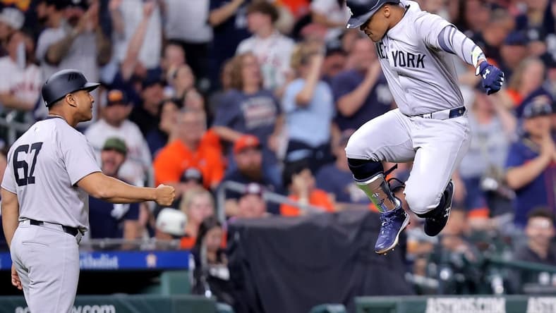 Mar 30, 2024; Houston, Texas, USA; New York Yankees right fielder Juan Soto (22, right) reacts after hitting a home run to left field against the Houston Astros during the seventh inning at Minute Maid Park. Mandatory Credit: Erik Williams-USA TODAY Sports
