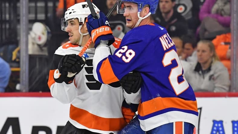 Apr 1, 2024; Philadelphia, Pennsylvania, USA; Philadelphia Flyers center Morgan Frost (48) and New York Islanders center Brock Nelson (29) battle for position during the second period at Wells Fargo Center. Mandatory Credit: Eric Hartline-USA TODAY Sports