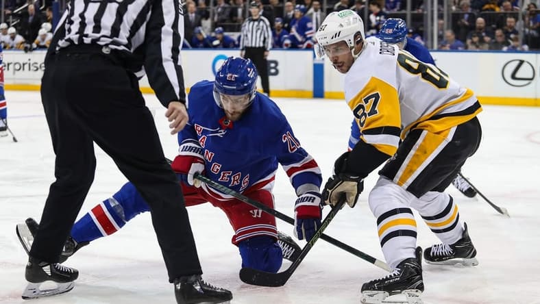 Apr 1, 2024; New York, New York, USA; New York Rangers center Barclay Goodrow (21) and Pittsburgh Penguins center Sidney Crosby (87) battle after a face-off during the second period at Madison Square Garden. Mandatory Credit: Danny Wild-USA TODAY Sports