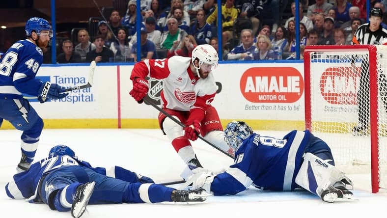 Apr 1, 2024; Tampa, Florida, USA;Tampa Bay Lightning goaltender Andrei Vasilevskiy (88) makes a save from Detroit Red Wings center Michael Rasmussen (27) during the second period at Amalie Arena. Mandatory Credit: Kim Klement Neitzel-USA TODAY Sports