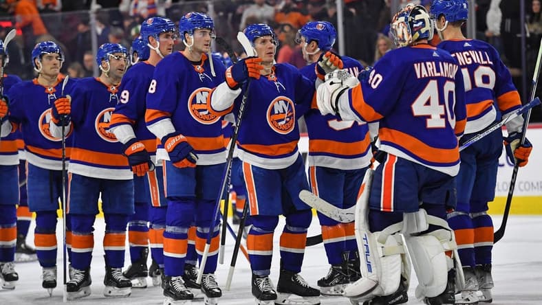 Apr 1, 2024; Philadelphia, Pennsylvania, USA; New York Islanders center Casey Cizikas (53) and goaltender Semyon Varlamov (40) celebrate win in overtime against the Philadelphia Flyers at Wells Fargo Center. Mandatory Credit: Eric Hartline-USA TODAY Sports