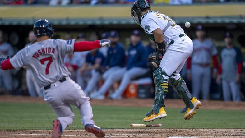 Apr 1, 2024; Oakland, California, USA; Boston Red Sox left fielder Masataka Yoshida (7) scores on the throw to Oakland Athletics catcher Shea Langeliers (23) during the second inning at Oakland-Alameda County Coliseum. Mandatory Credit: Neville E. Guard-USA TODAY Sports