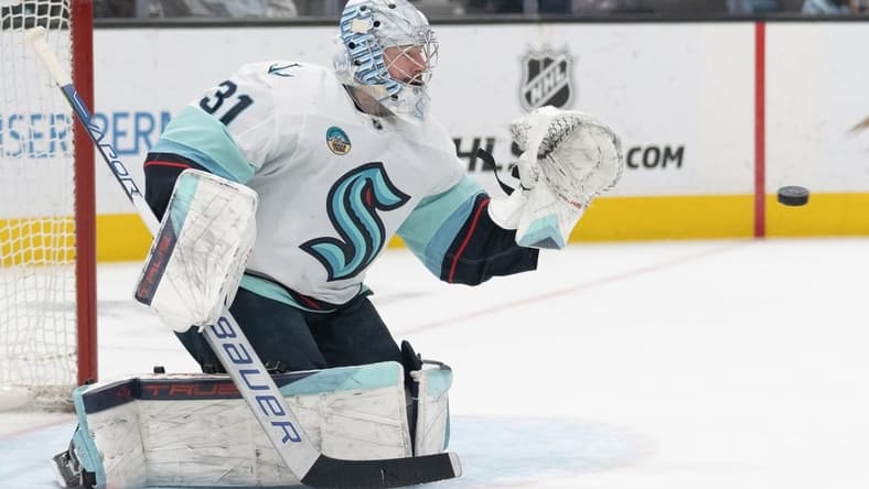Apr 1, 2024; San Jose, California, USA; Seattle Kraken goaltender Philipp Grubauer (31) prepares to catch the puck during the second period against the San Jose Sharks at SAP Center at San Jose. Mandatory Credit: Stan Szeto-USA TODAY Sports