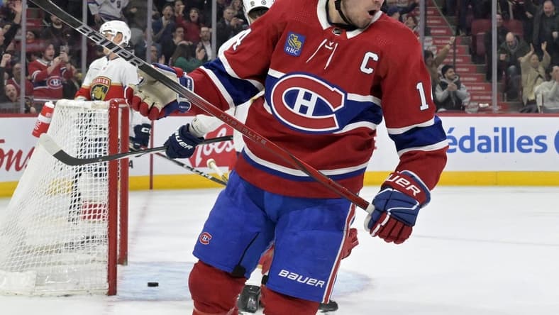 Apr 2, 2024; Montreal, Quebec, CAN; Montreal Canadiens forward Nick Suzuki (14) celebrates after scoring a goal against the Florida Panthers during the second period at the Bell Centre. Mandatory Credit: Eric Bolte-USA TODAY Sports