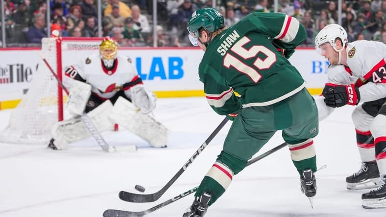 Apr 2, 2024; Saint Paul, Minnesota, USA; Minnesota Wild center Mason Shaw (15) shoots against the Ottawa Senators goaltender Joonas Korpisalo (70) in the second period at Xcel Energy Center. Mandatory Credit: Brad Rempel-USA TODAY Sports