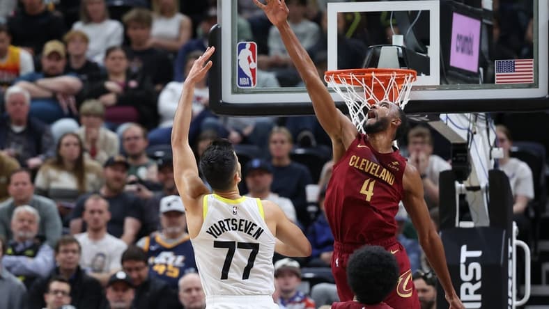 Apr 2, 2024; Salt Lake City, Utah, USA; Cleveland Cavaliers forward Evan Mobley (4) blocks the shot of Utah Jazz center Omer Yurtseven (77) during the second quarter at Delta Center. Mandatory Credit: Rob Gray-USA TODAY Sports