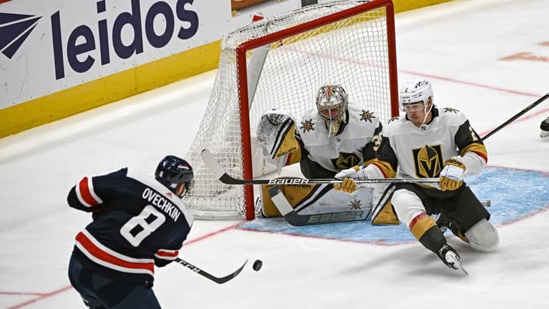 WASHINGTON, DC - NOVEMBER 01: Washington Capitals left wing Alex Ovechkin (8) fires a shot that is saved by Vegas Golden Knights defenseman Zach Whitecloud (2) and goaltender Logan Thompson (36) during the Las Vegas Golden Knights game versus the Washington Capitals on November 1, 2022 at the Capital One Arena in Washington, D.C. (Photo by Mark Goldman/Icon Sportswire)