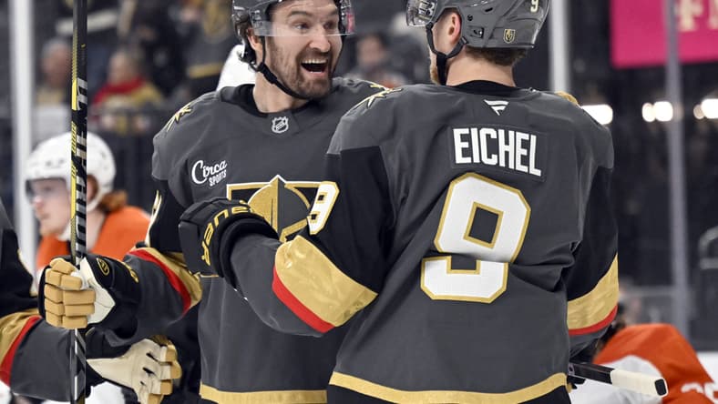 Vegas Golden Knights right wing Mark Stone, left, celebrates with center Jack Eichel (9) after scoring against the Philadelphia Flyers during the second period of an NHL hockey game Thursday, Jan. 2, 2025, in Las Vegas. (AP Photo/David Becker)
