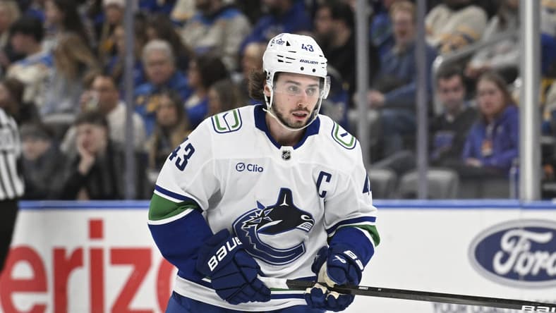 Vancouver Canucks' Quinn Hughes (43) in action against the St. Louis Blues during the second period of an NHL hockey game Monday, Jan. 27, 2025, in St. Louis. (AP Photo/Joe Puetz)