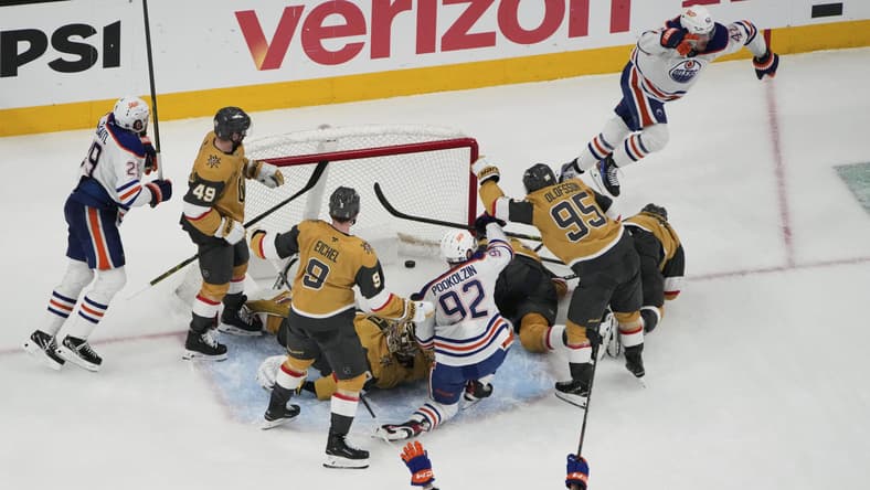 Edmonton Oilers right wing Kasperi Kapanen, upper right, celebrates after scoring against the Vegas Golden Knights during overtime of Game 5 of a second-round NHL hockey playoff series Wednesday, May 14, 2025, in Las Vegas. (AP Photo/John Locher)