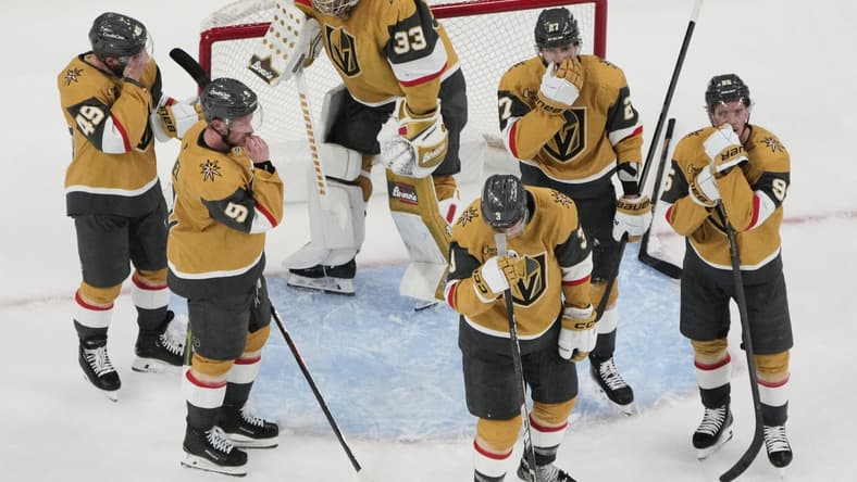 Vegas Golden Knights players react after losing to the Edmonton Oilers in overtime of Game 5 of a second-round NHL hockey playoff series Wednesday, May 14, 2025, in Las Vegas. (AP Photo/John Locher)