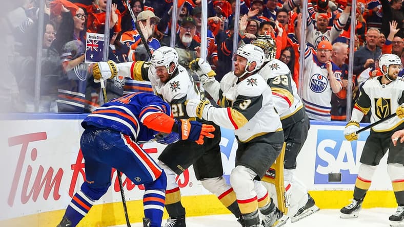 EDMONTON, AB - MAY 12: Las Vegas Golden Knights Center Brett Howden (21) and Las Vegas Golden Knights Goalie Aden Hill (33) attack Edmonton Oilers Right Wing Evander Kane (91) in the first period of the Stanley Cup Playoffs Second Round Edmonton Oilers game versus the Las Vegas Golden Knights on May 12, 2025 at Rogers Place in Edmonton, AB. (Photo by Curtis Comeau/Icon Sportswear)