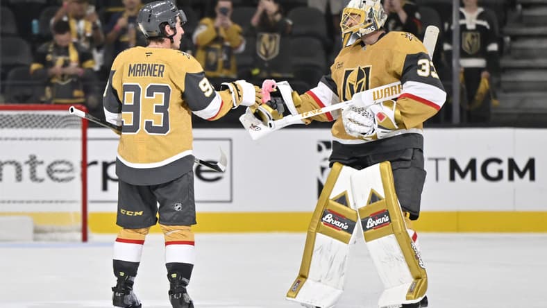 Adin Hill gives the victory flamingo to Mitch Marner 9/25/2025 (Photo/Screenshot- Vegas Golden Knights via Twitter)