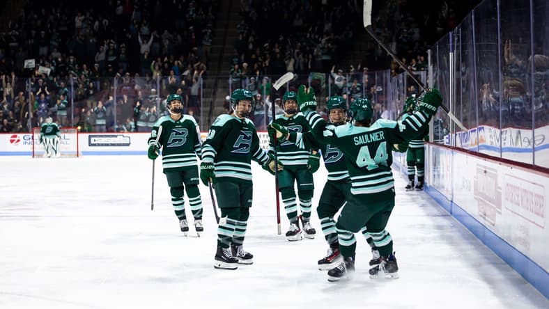 The Boston Fleet celebrate after a goal against the Vancouver Goldeneyes.