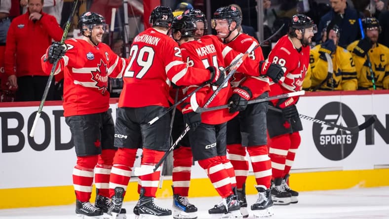 Mitch Marner (16) of Team Canada celebrates with teammates after scoring a goal during the (OT) period of the 4 Nations Face-Off game between Canada and Sweden on February 12, 2025, at Bell Centre in Montreal, Quebec