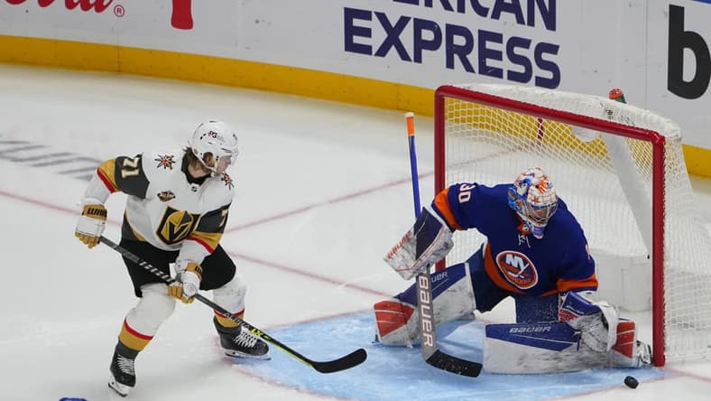 ELMONT, NY - DECEMBER 19: New York Islanders Goalie Ilya Sorokin (30) makes a save of a shot on goal by Vegas Golden Knights Center William Karlsson (71) during the third period of the National Hockey League game between the Vegas Golden Knights and the New York Islanders on December 19, 2021, at UBS Arena in Elmont, NY. (Photo by Gregory Fisher/Icon Sportswire)