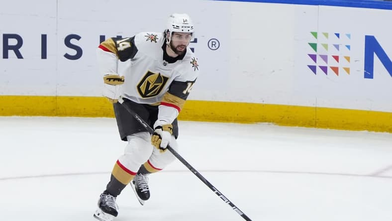 ELMONT, NY - FEBRUARY 04: Vegas Golden Knights Defenseman Nicolas Hague (14) skates with the puck during the third period of the National Hockey League game between the Vegas Golden Knights and the New York Islanders on February 4, 2025, at UBS Arena in Elmont, NY. (Photo by Gregory Fisher/Icon Sportswire)