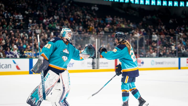 New York Sirens goalie Kayle Osborne and rookie forward Casey O'Brien fist bump after a comeback win over the Seattle Torrent.