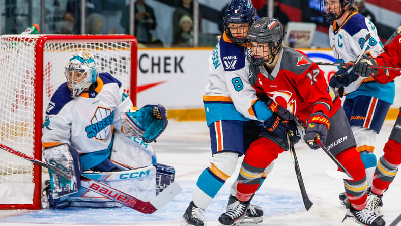New York Sirens defenders Maja Nylen Persson and Micah Zandee-Hart protect the net against the Ottawa Charge.
